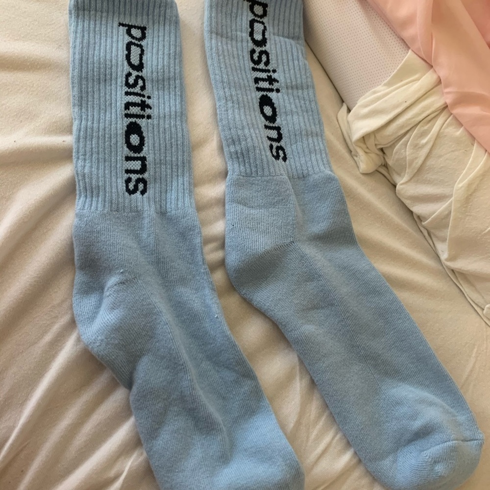 Ariana Grandes positions socks